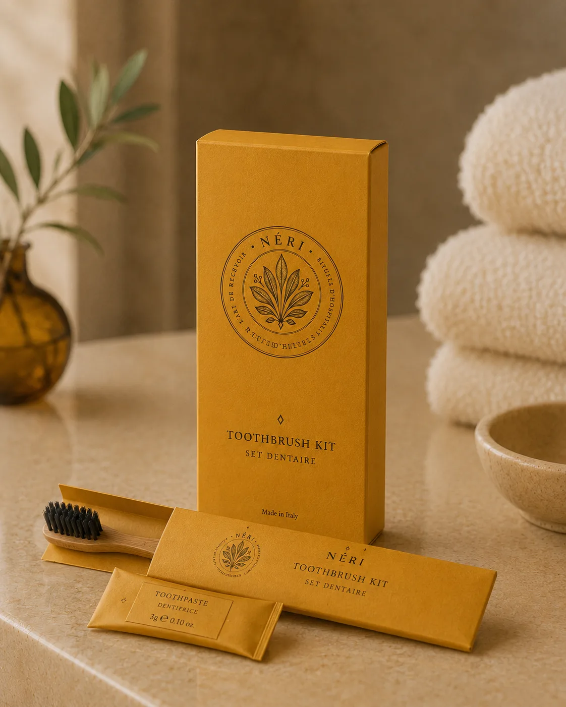 NÉRI toothbrush kit — ochre box, kraft sleeves and bamboo toothbrush with charcoal bristles